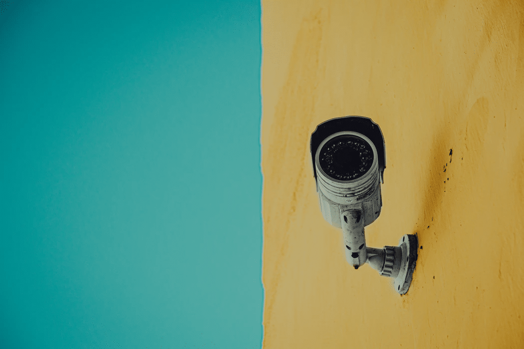 A security camera mounted on a wall