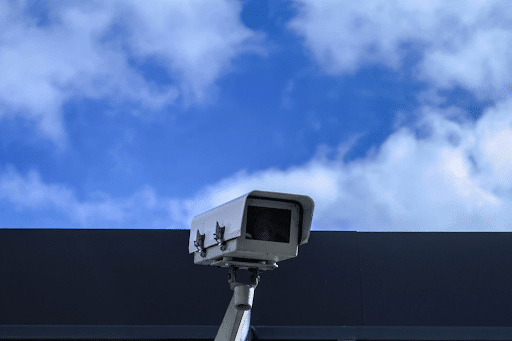 A security camera with the sky in the background