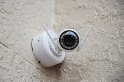 A wireless security camera in the corner