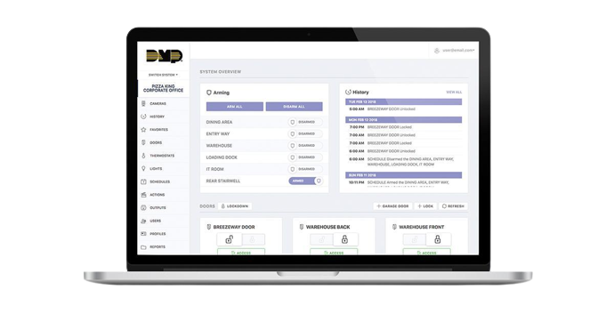 A laptop with the DMP cloud app on the screen showing security for different areas of a corporate office